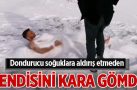 Dondurucu soğuklara aldırış etmeden kendisini kara gömdü